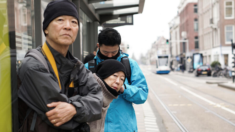 People Waiting at Bus Stop